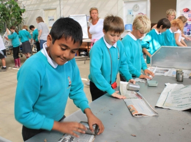 School making paper pots in growing lab